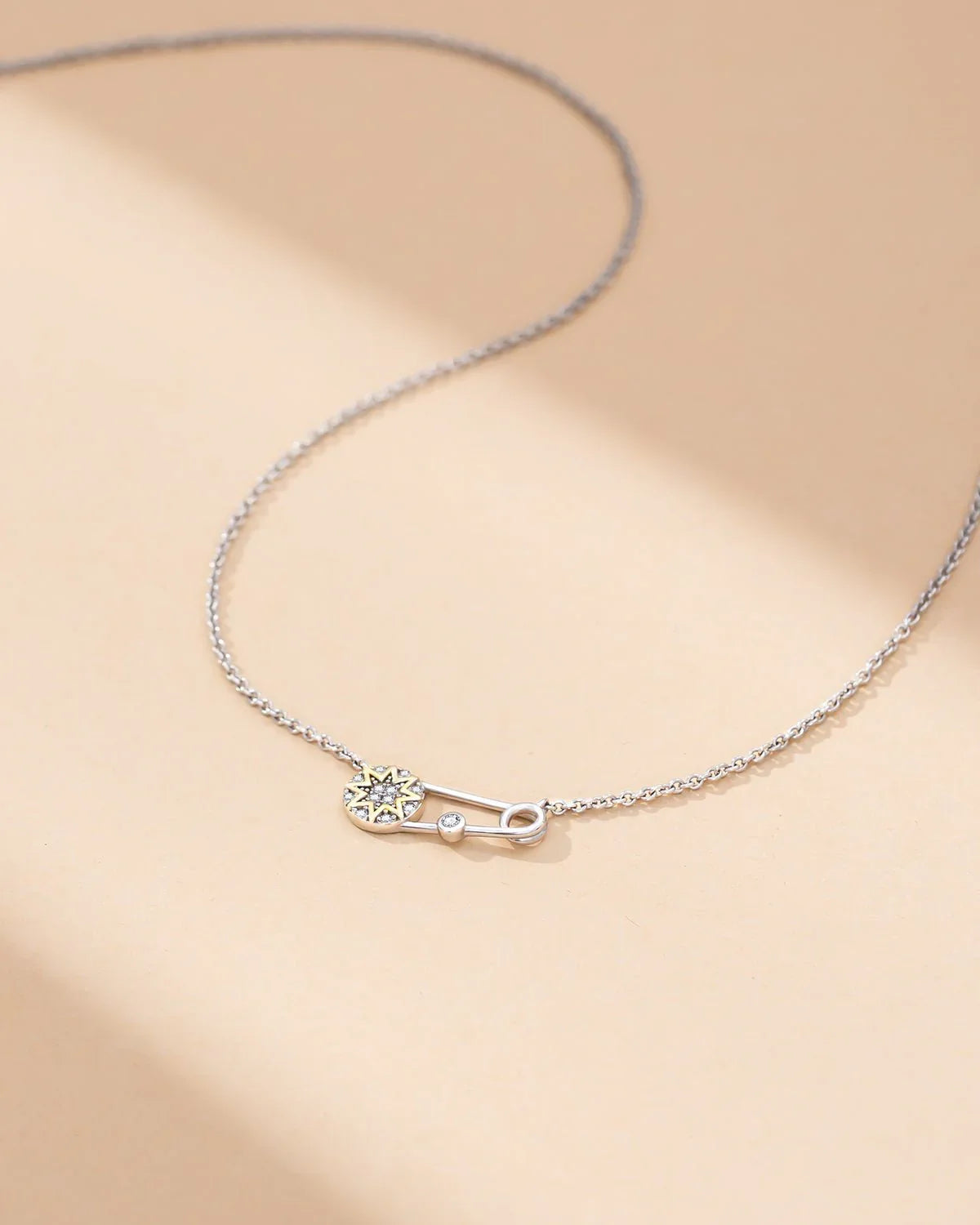 safety pin necklace with star pendant and cubic zirconia